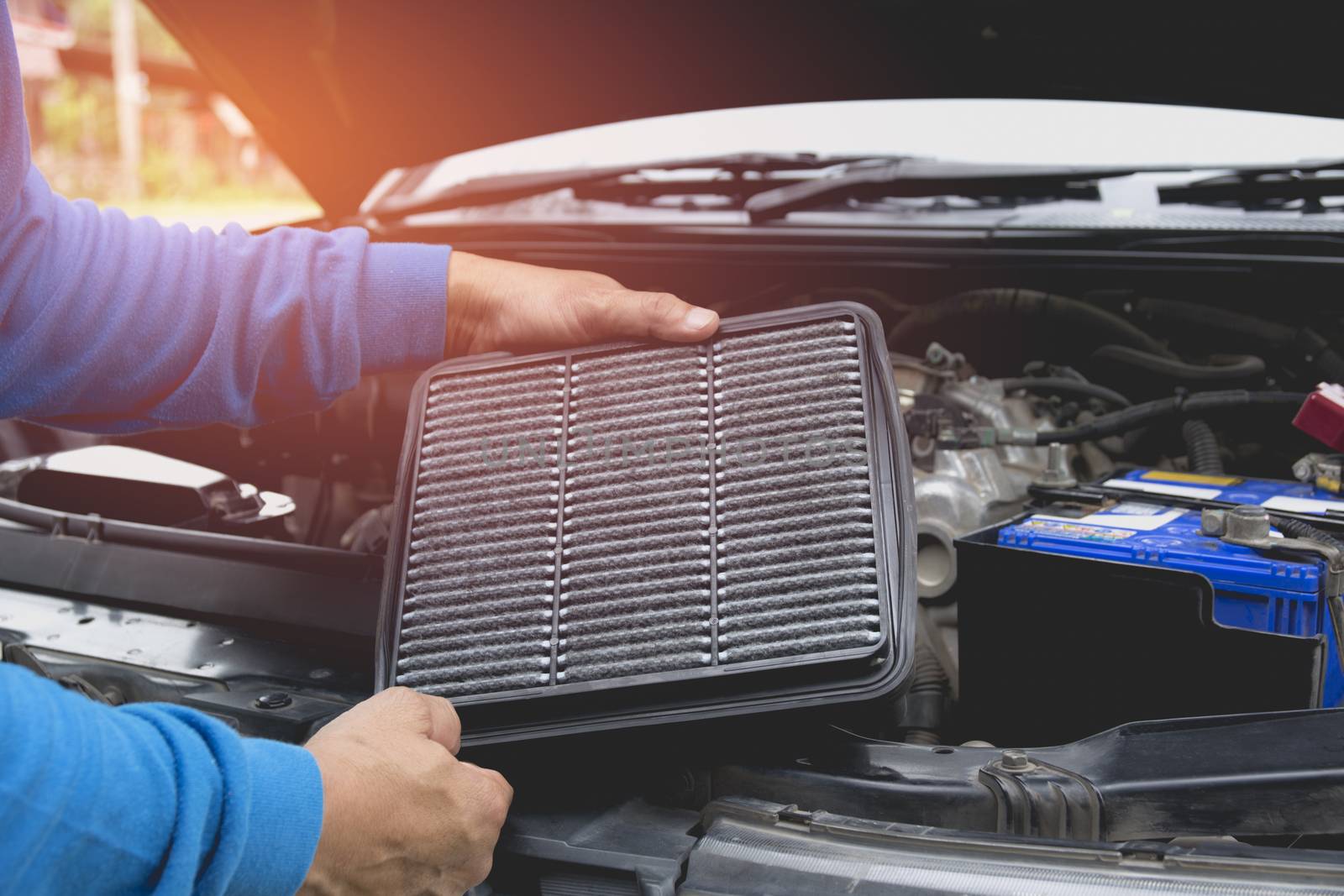 Hand of technician checking engine of car. Auto mechanic checkin by kirisa99