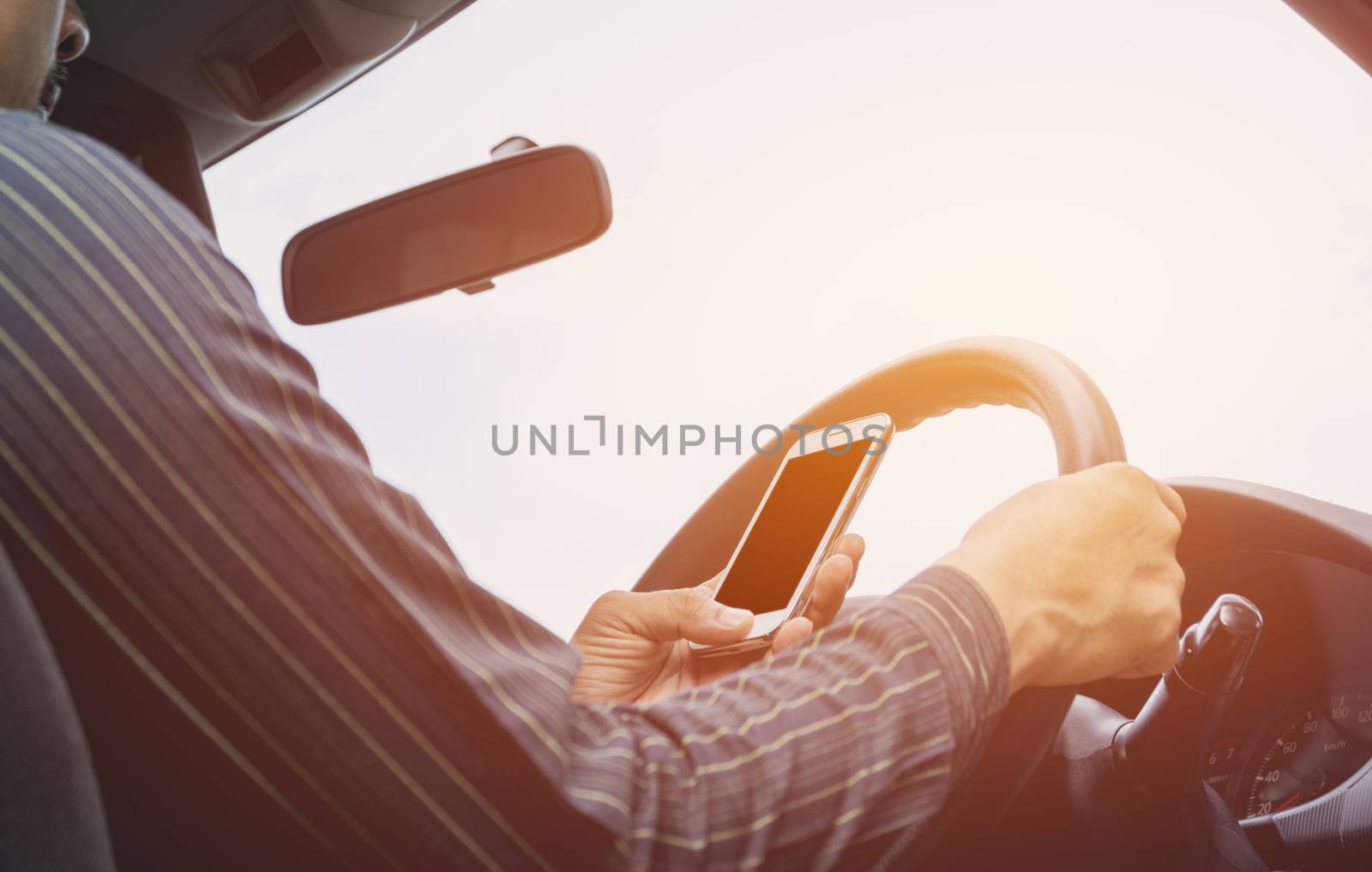 Man driving car. Hands of male is driver on steering wheel car. Vintage style.