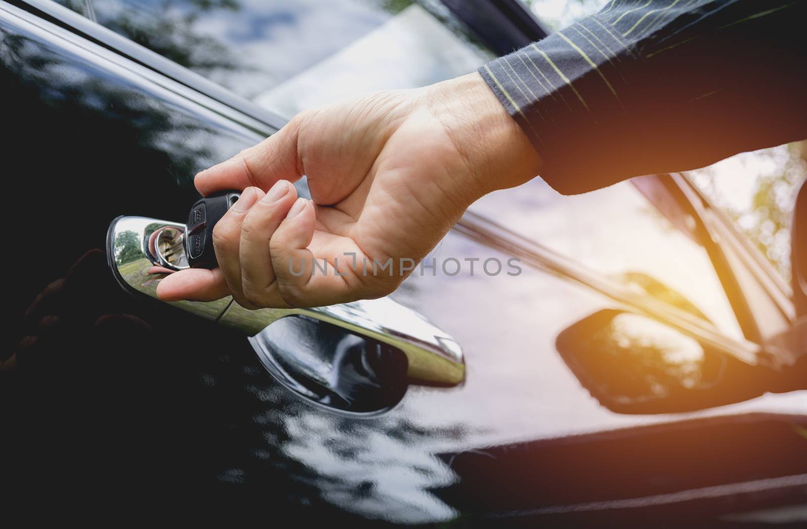 Close-up of man opening a car door. Hand on handle. Businessman  by kirisa99