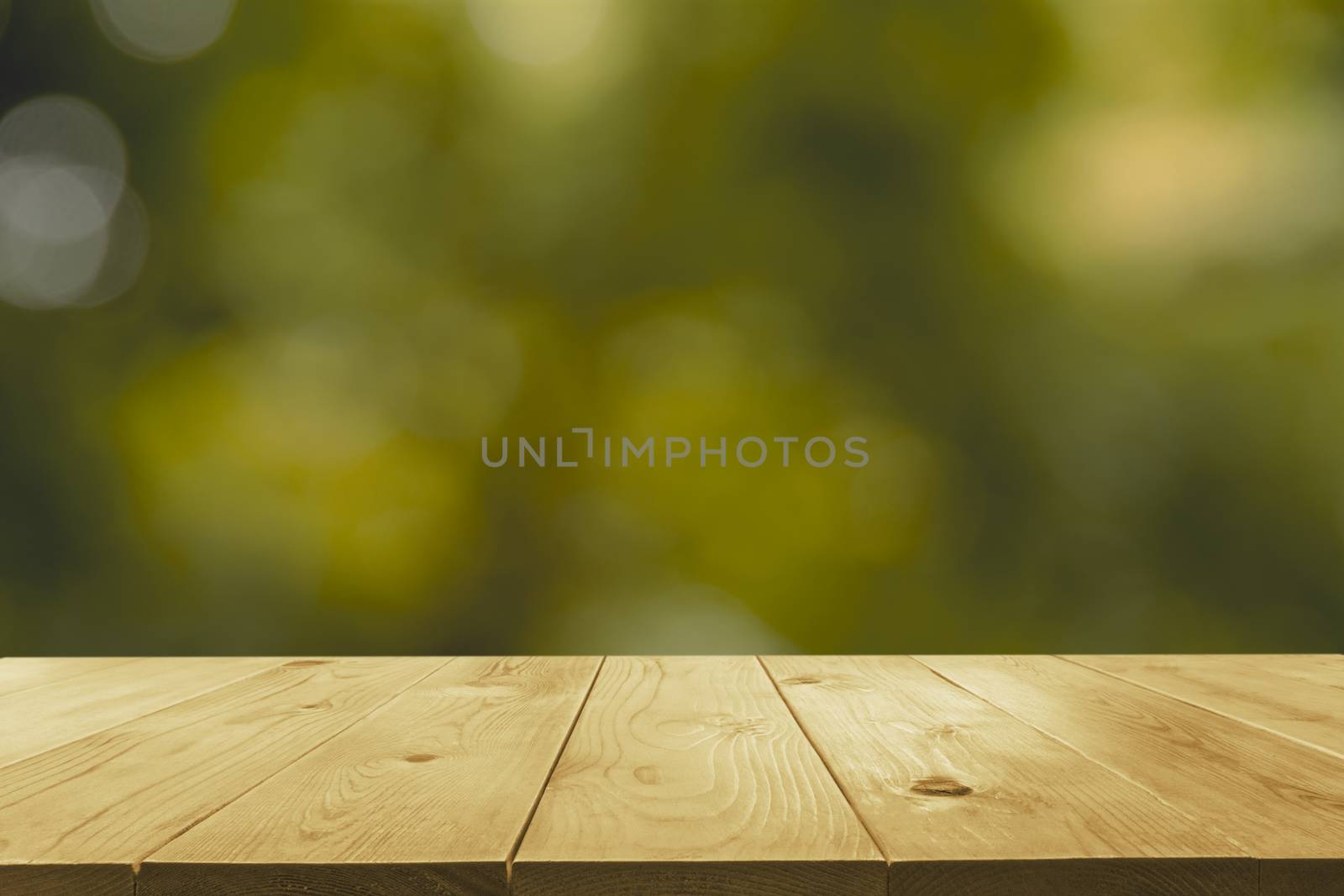 Empty wooden table with blurred green natural abstract backgroun by kirisa99