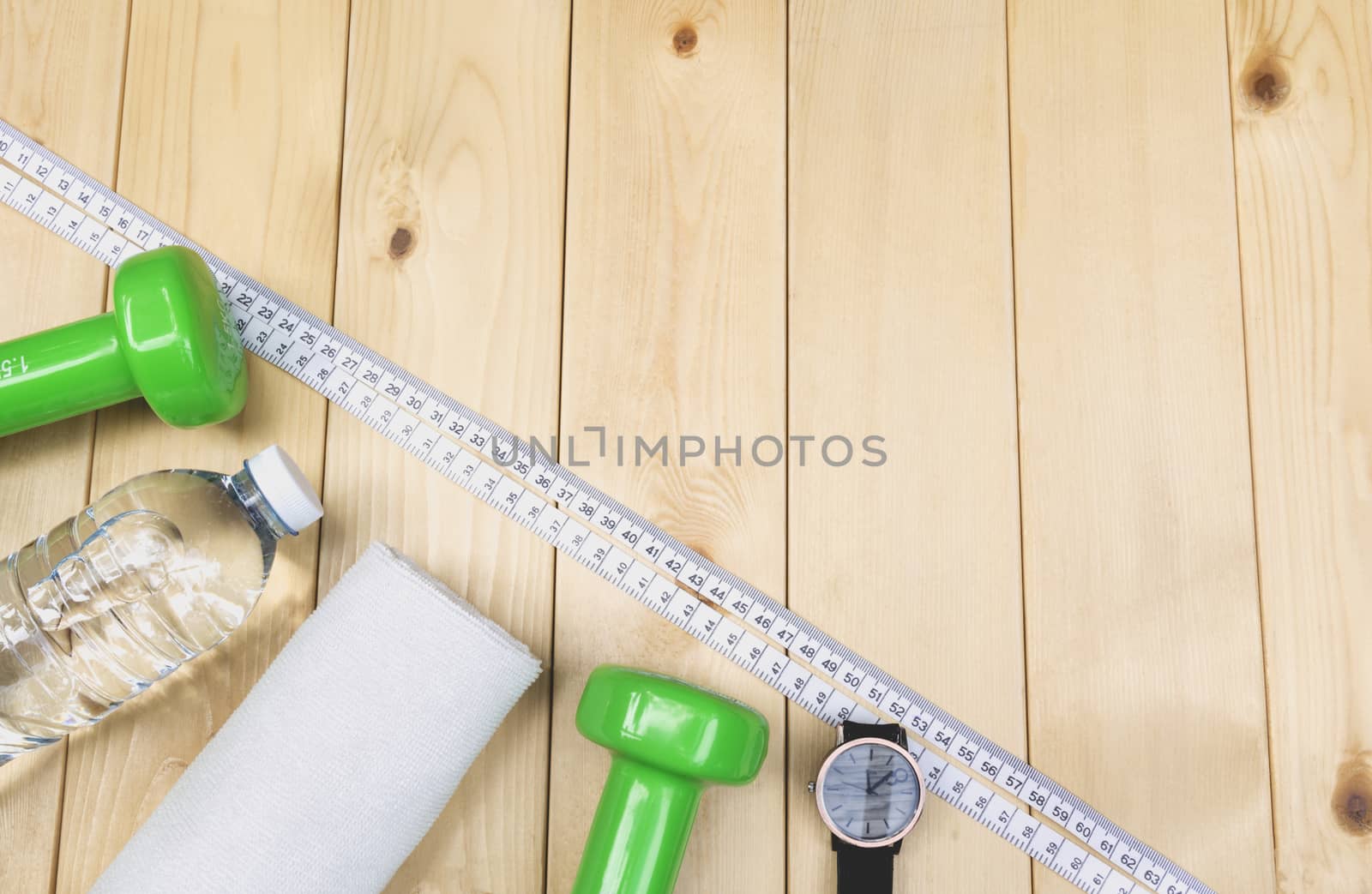 concept preparing to fitness sports equipment top view on wooden background.