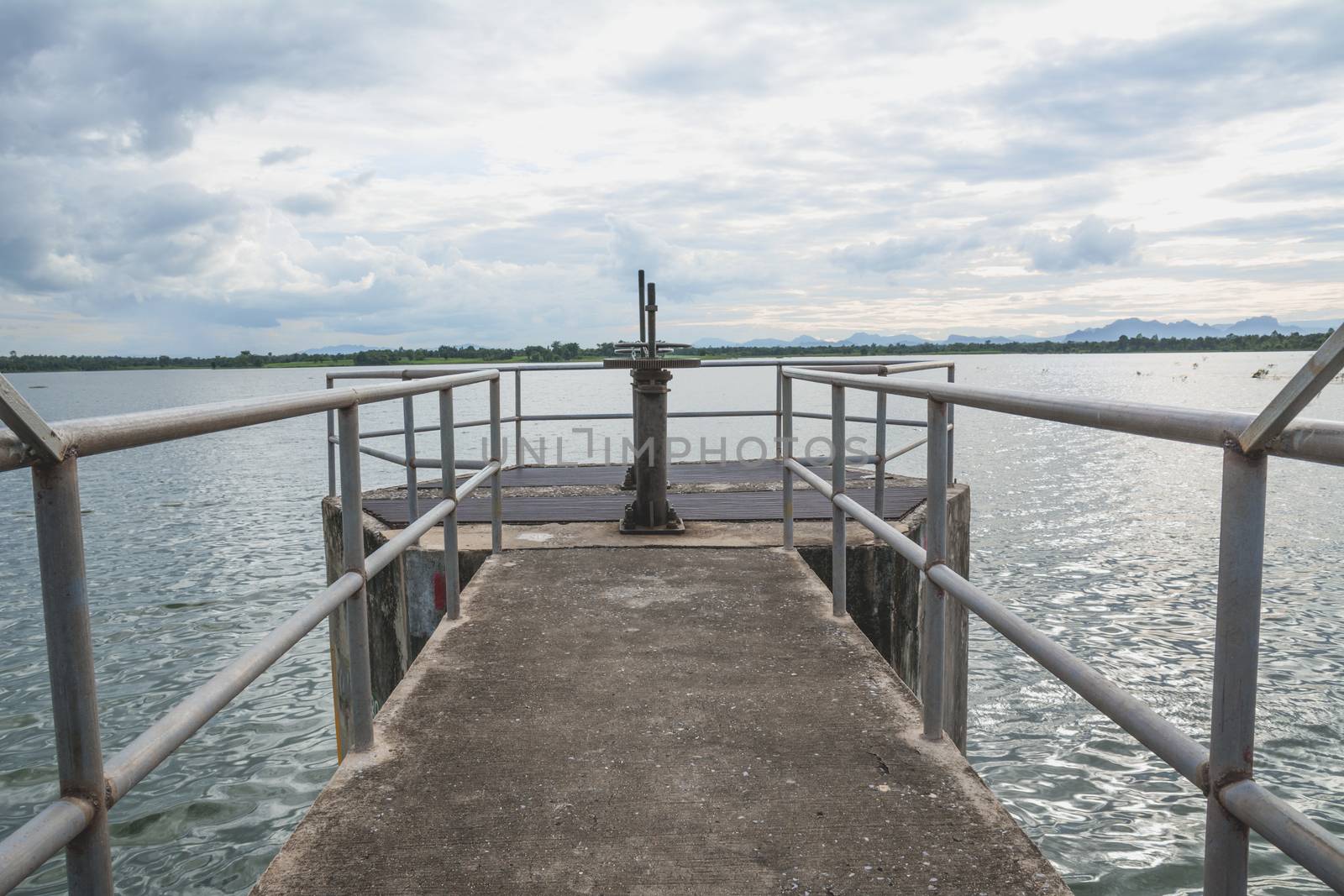 The floodgates on a dam in a river from in Thailand. Floodgate construction.