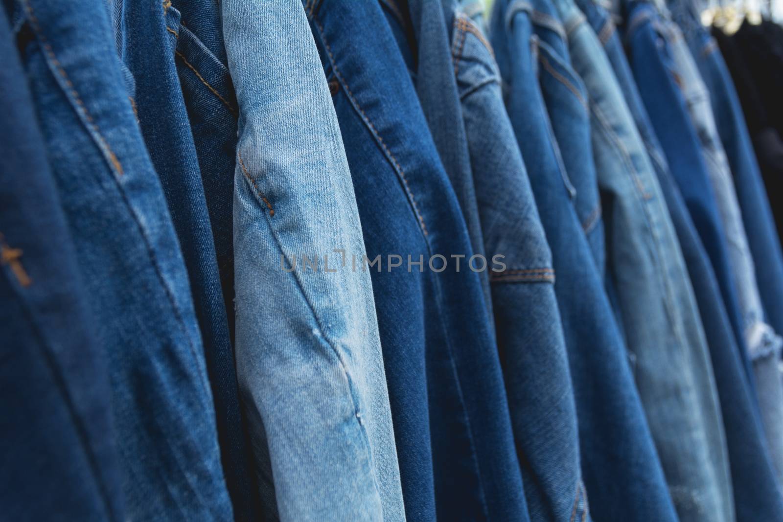 Blue denim jeans background. Blue jeans lined  in market.