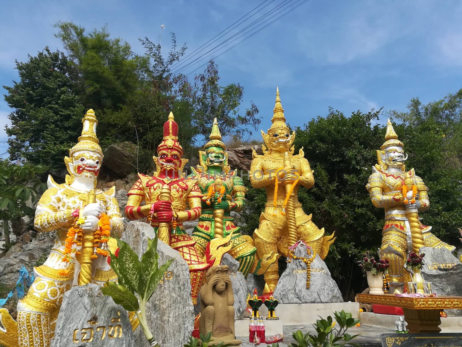 Worship Buddhist pavilion statue at Temple in Thailand  And his by shatchaya