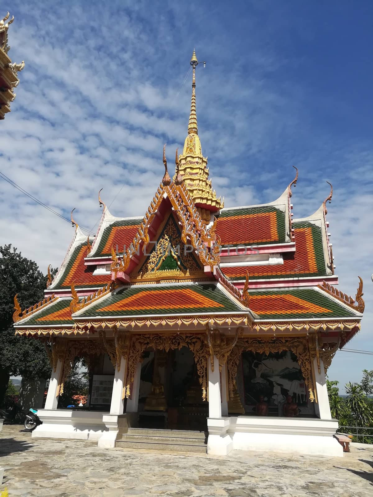 Worship Buddhist pavilion statue at Temple in Thailand  And his by shatchaya