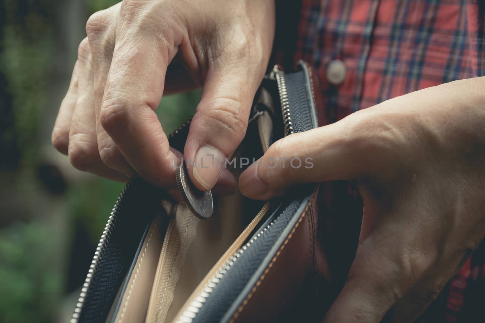 Close-up woman standing and holding money coin with wallet empty of money