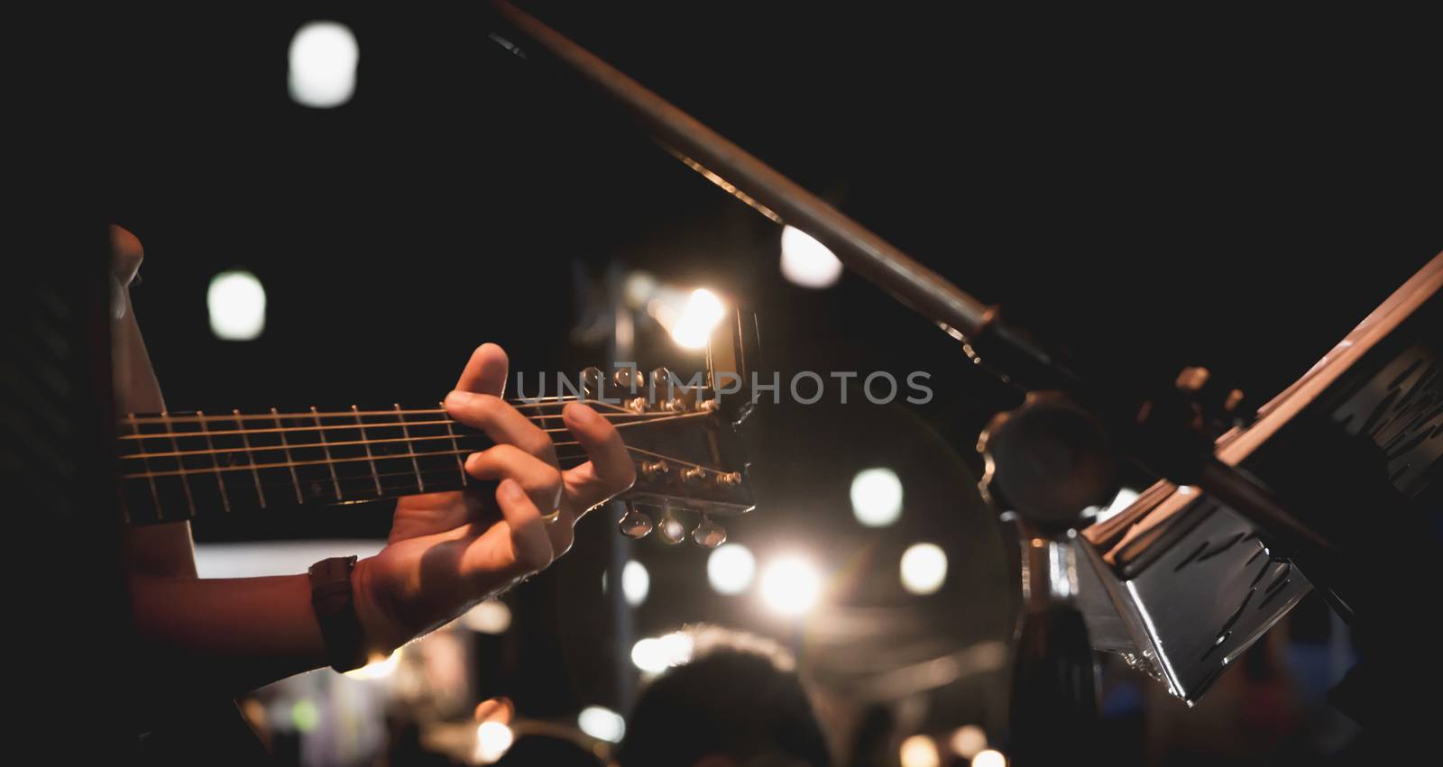 Guitarist on stage. Guitarist playing guitar, soft and blur concept.