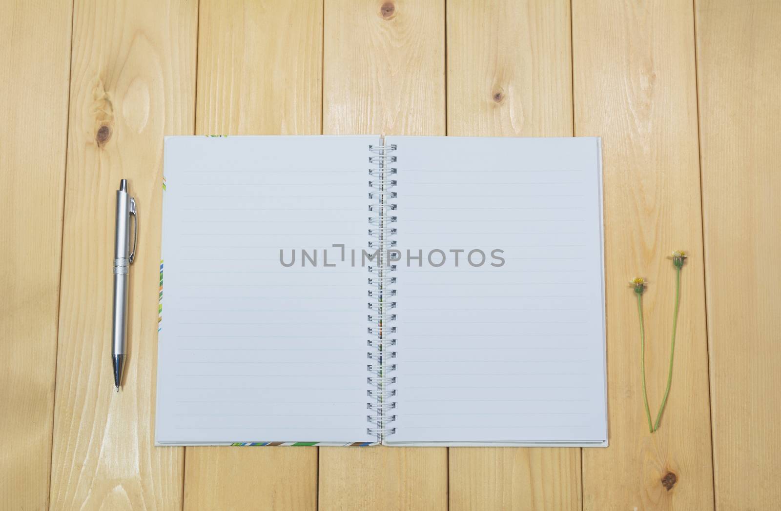 Top view of open book. Book open on wooden table background.