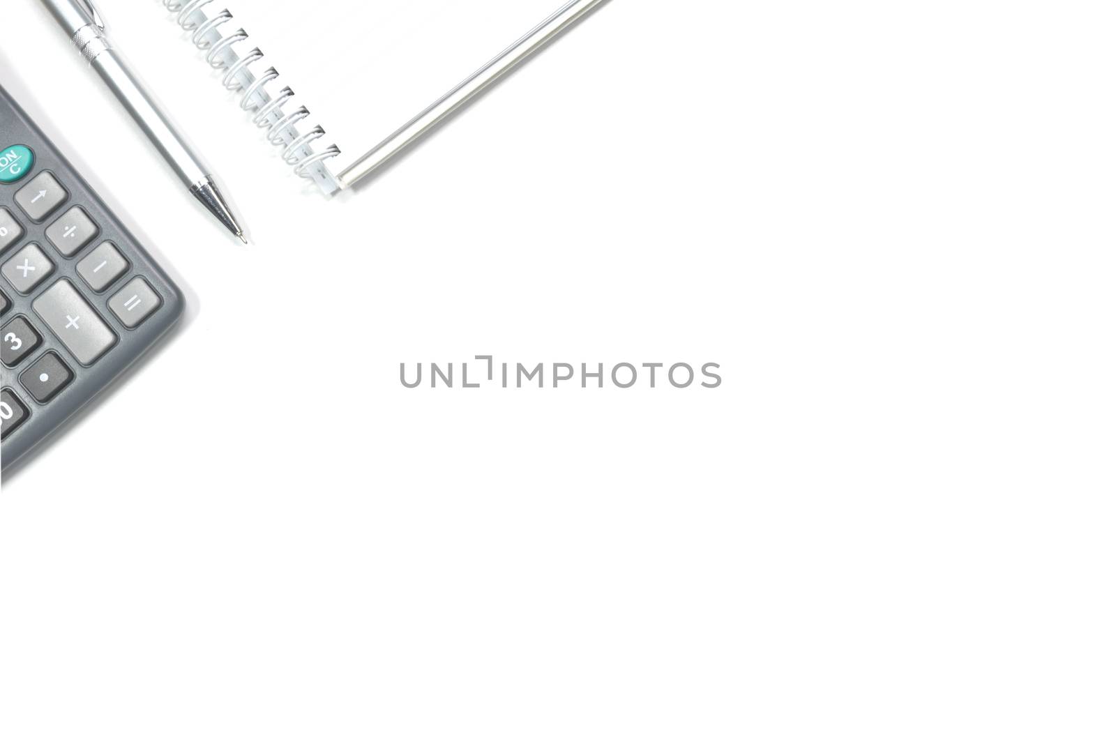Top view of note book, pen and calculator isolated on white background with copy space. 