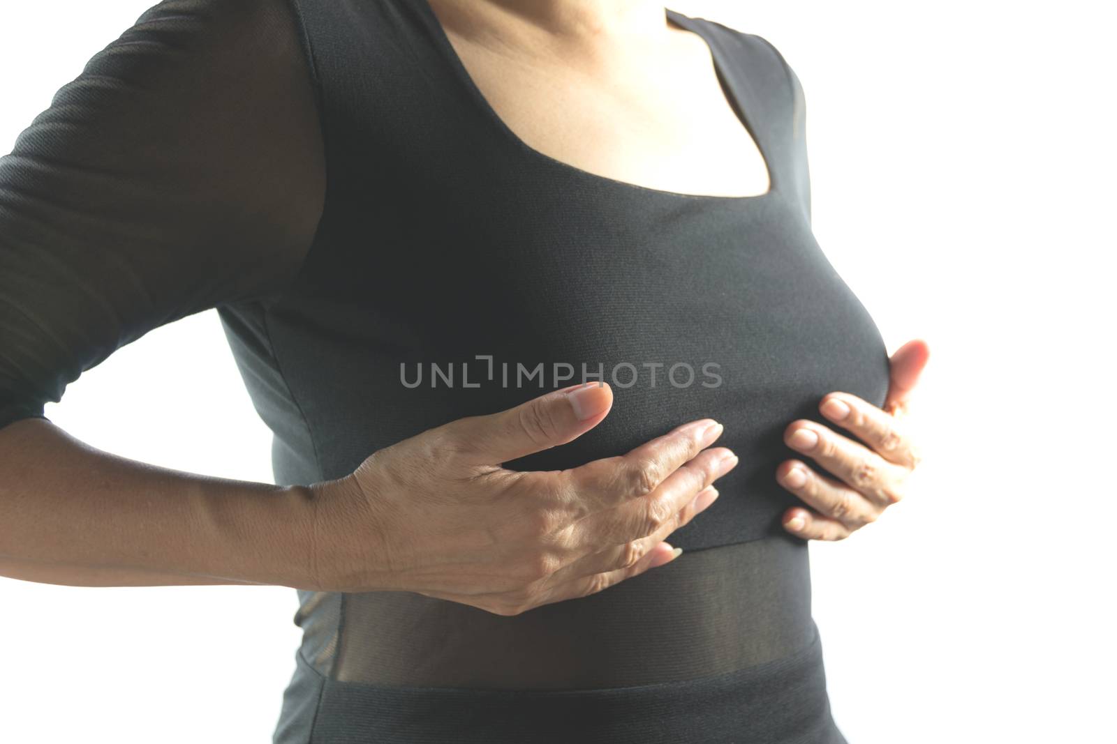 Breast cancer self check. Closeup woman with breast cancer checking isolated on white background. Healthy lifestyle concept.