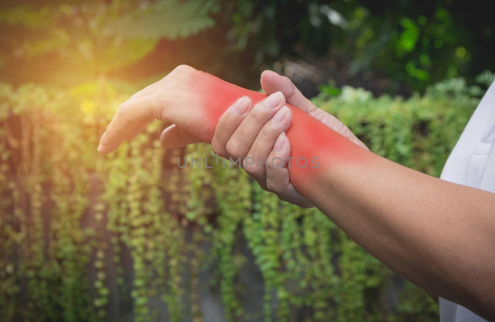 Man holding his wrist. Pain in a man wrist. Man massaging painful wrist. pain concept.