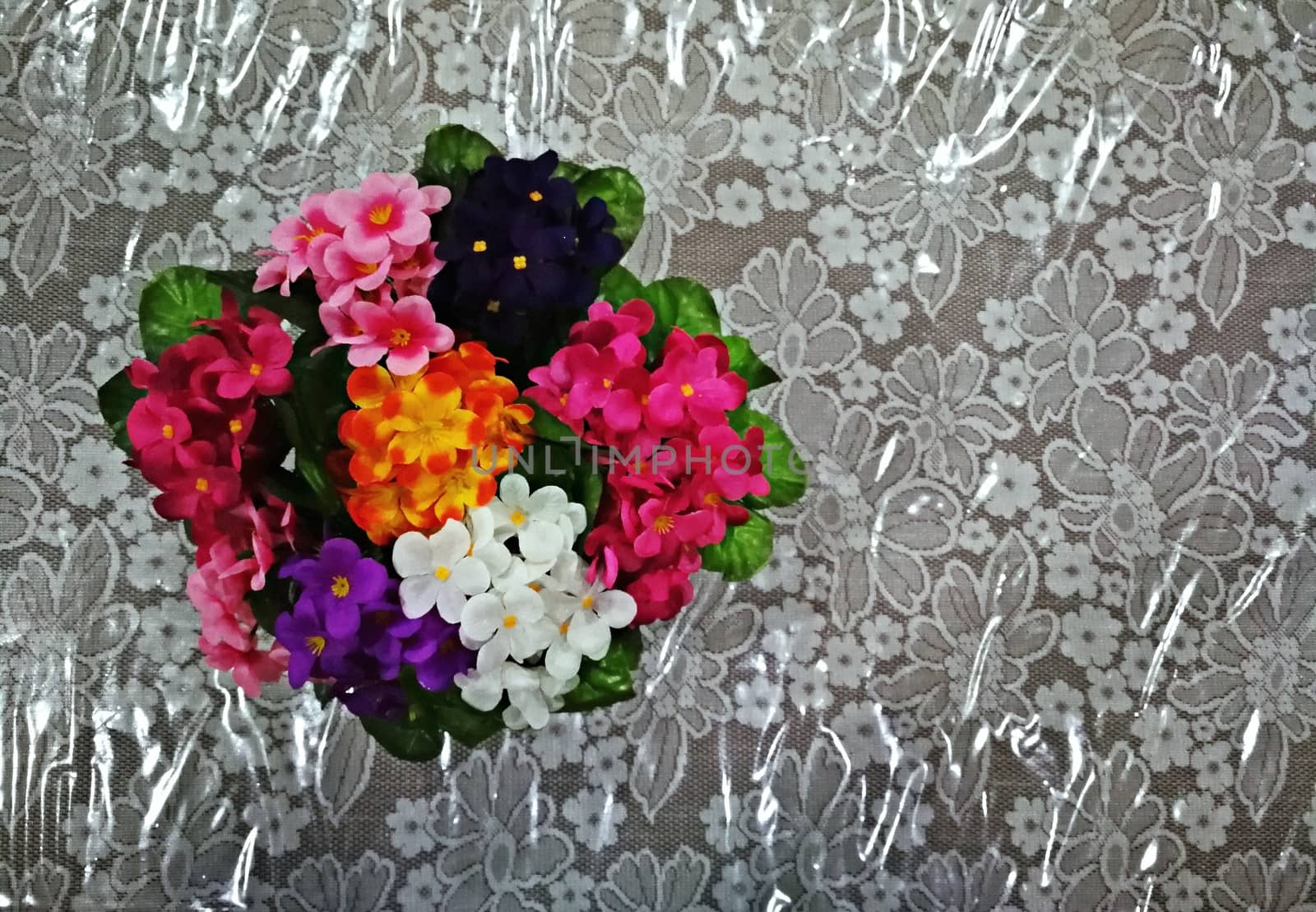 multi color of plastic flowers for decorations on office table