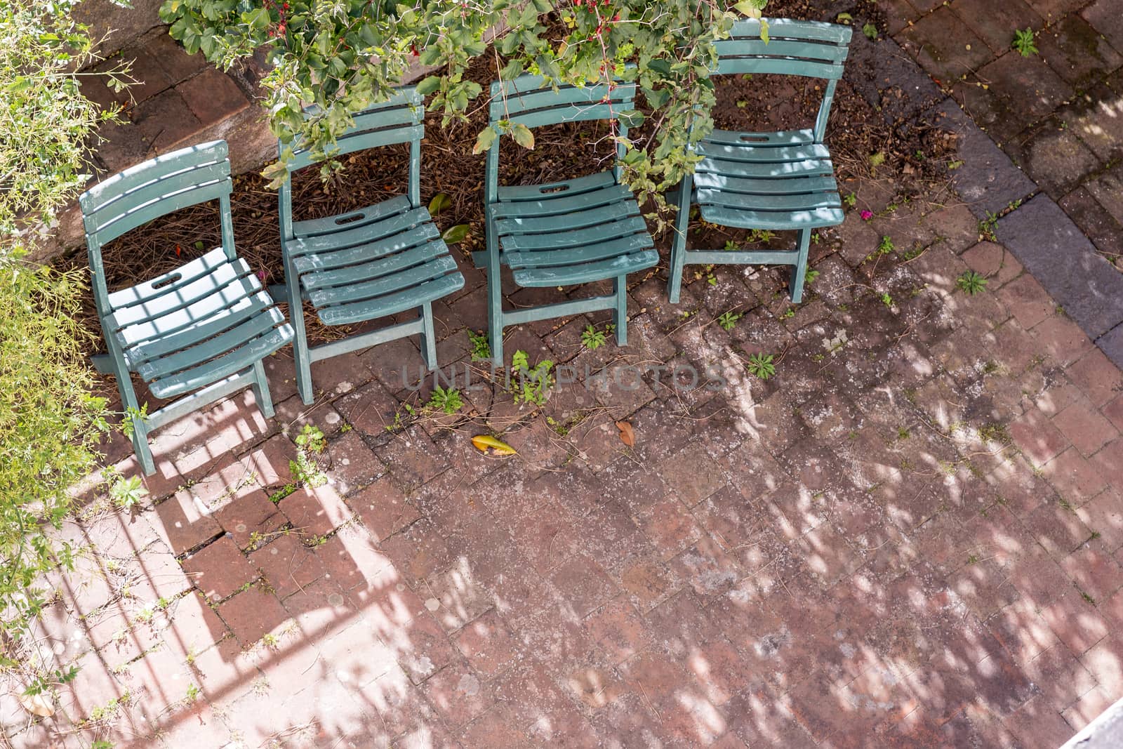 The four green chairs waiting for someone