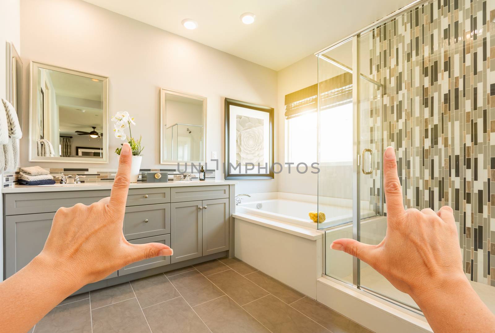 Hands Framing Custom Master Bathroom Interior.