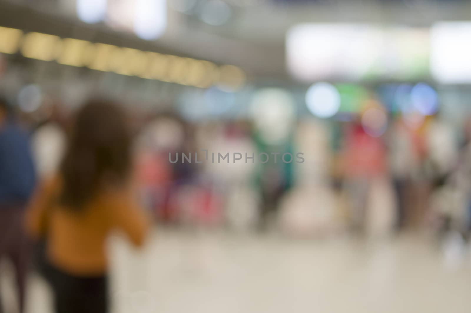 Abstract blurred tourism with baggage waiting for check in at airport terminal. Business travel and rush concept photography.