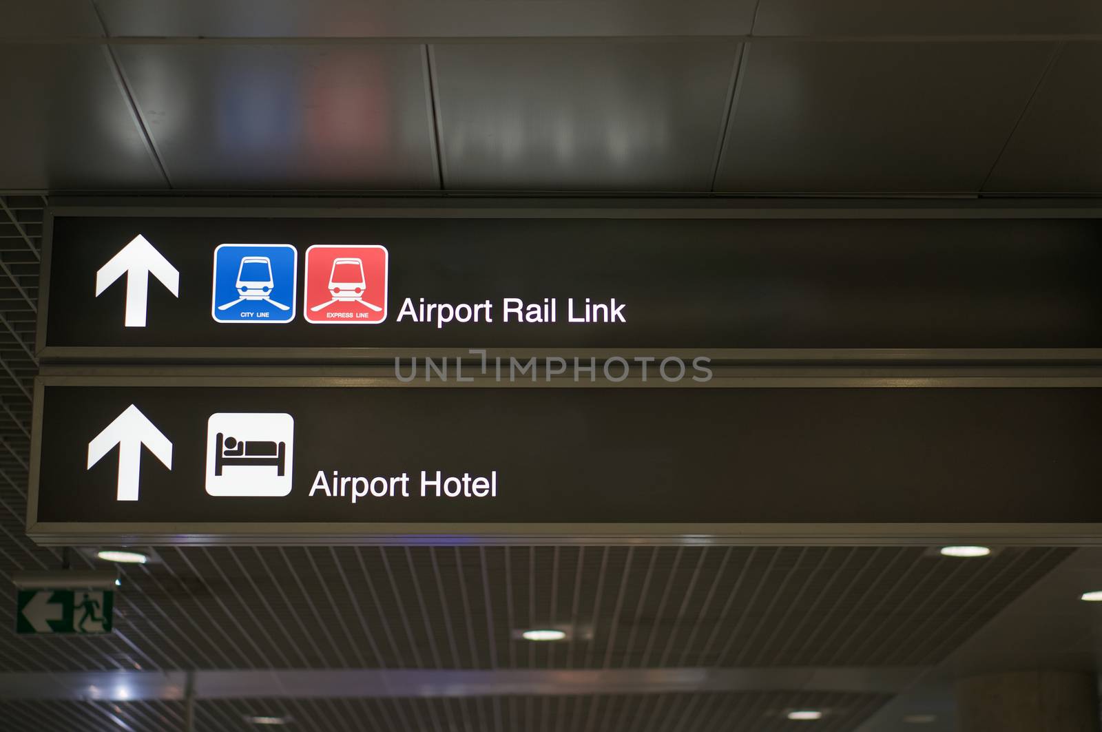 Airport rail link and airport hotel information board sign with white character on black background at international airport terminal.