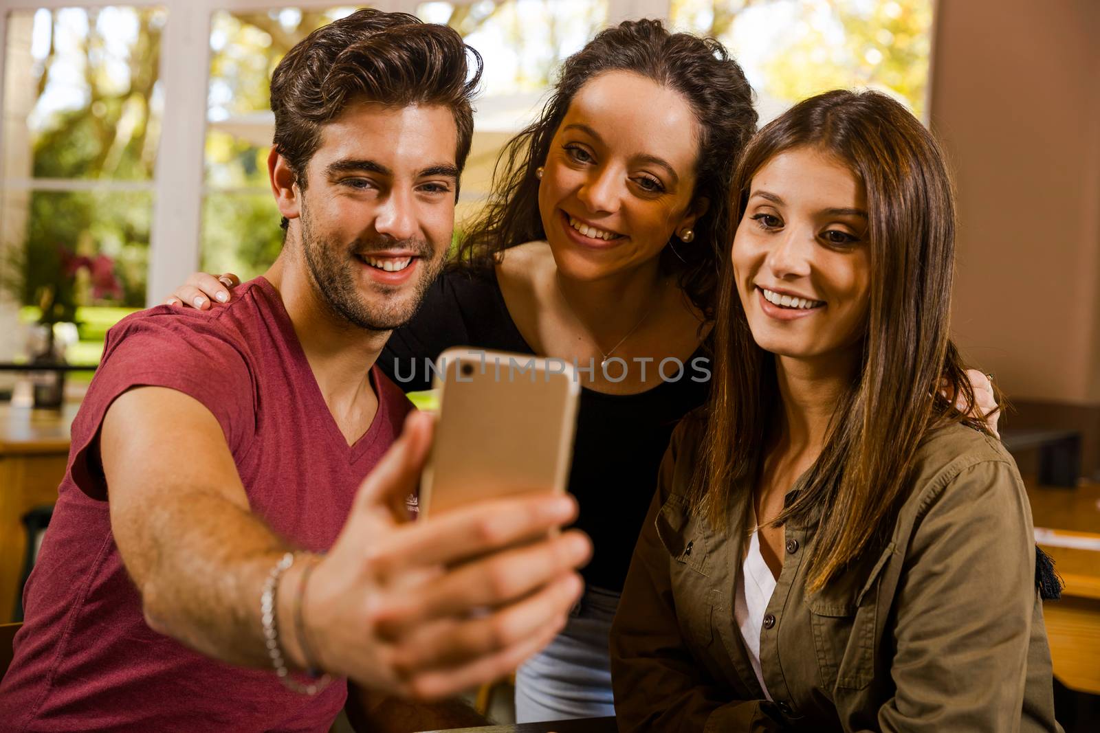 A groups of students making a selfie during a pause on the studies