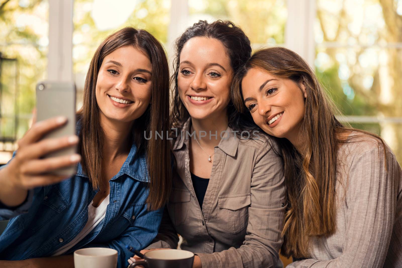Groups of female firends making a selfie during a pause on the studies