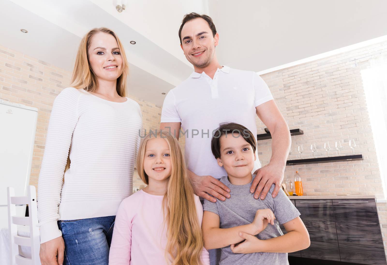 Portrait of a happy family smiling at home