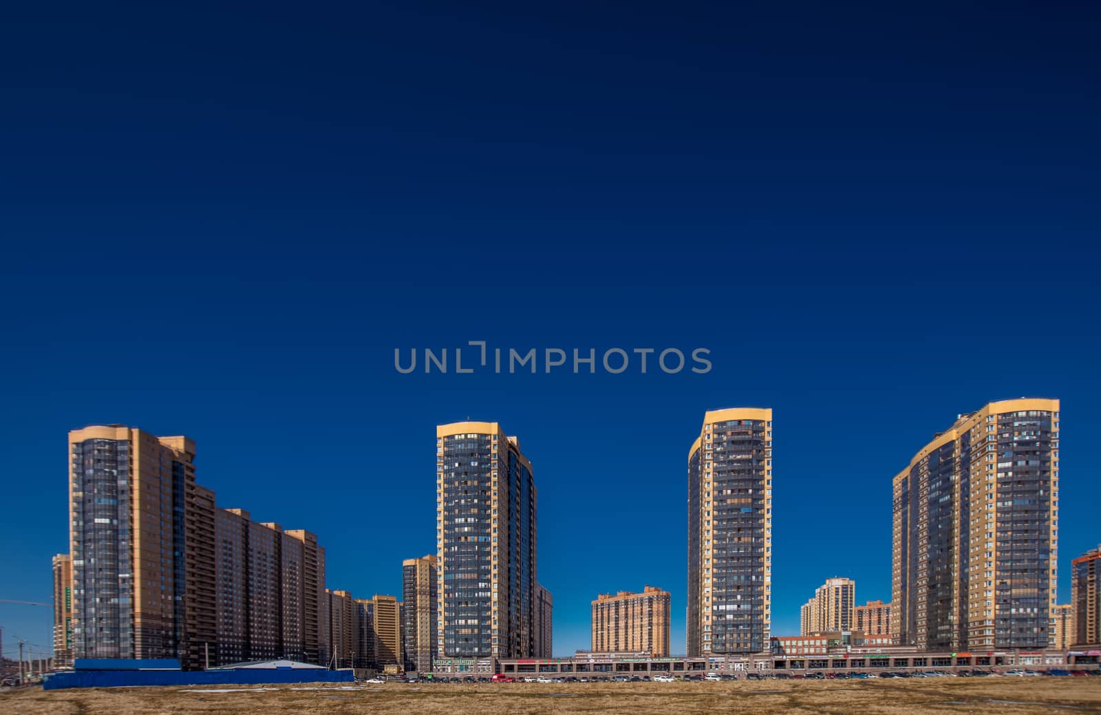 New residential apartment buildings over deep blue sky