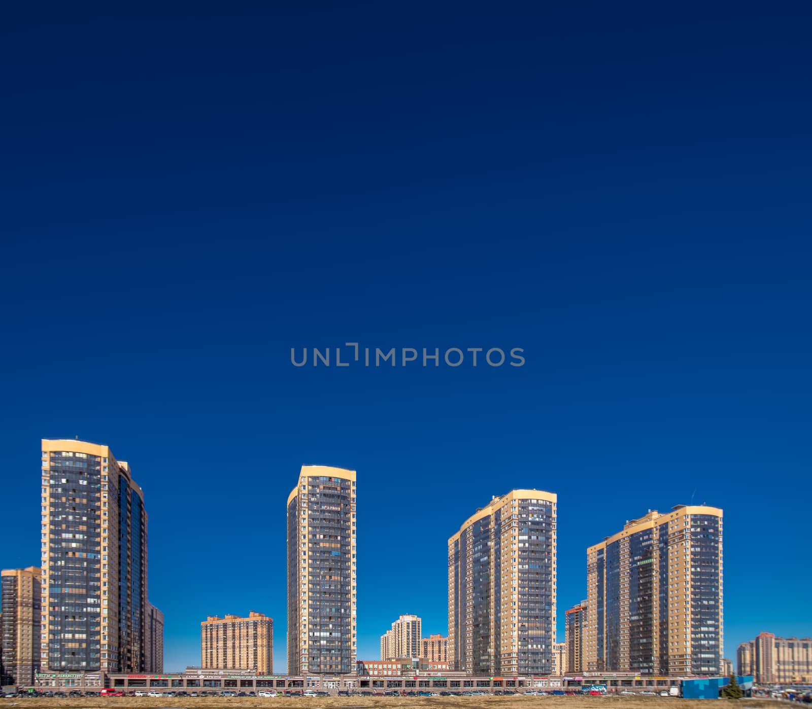 New residential apartment buildings over deep blue sky