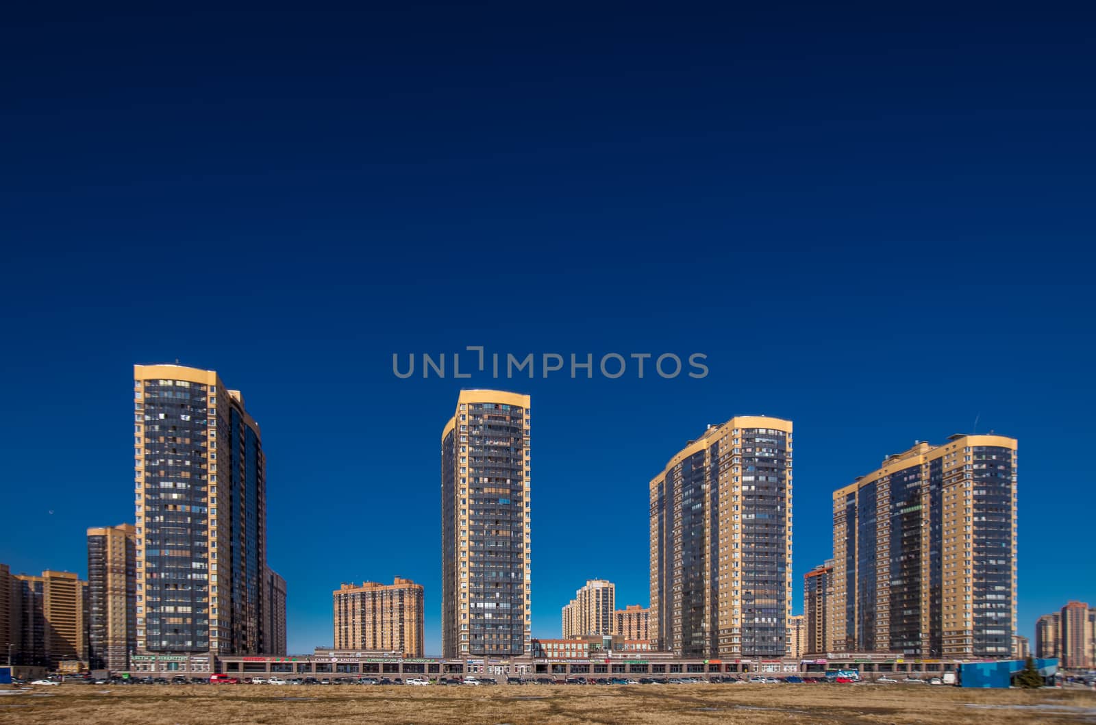 New residential apartment buildings over deep blue sky