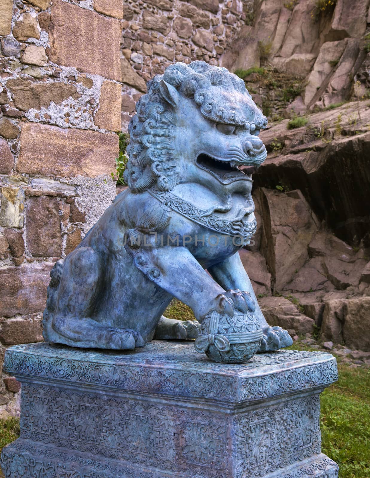 Traditional asian lion sculpture guarding an entrance