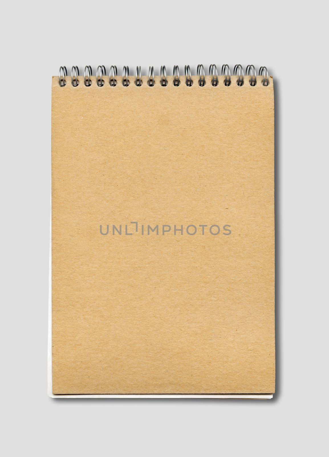 Spiral closed notebook mockup, brown paper cover, isolated on grey