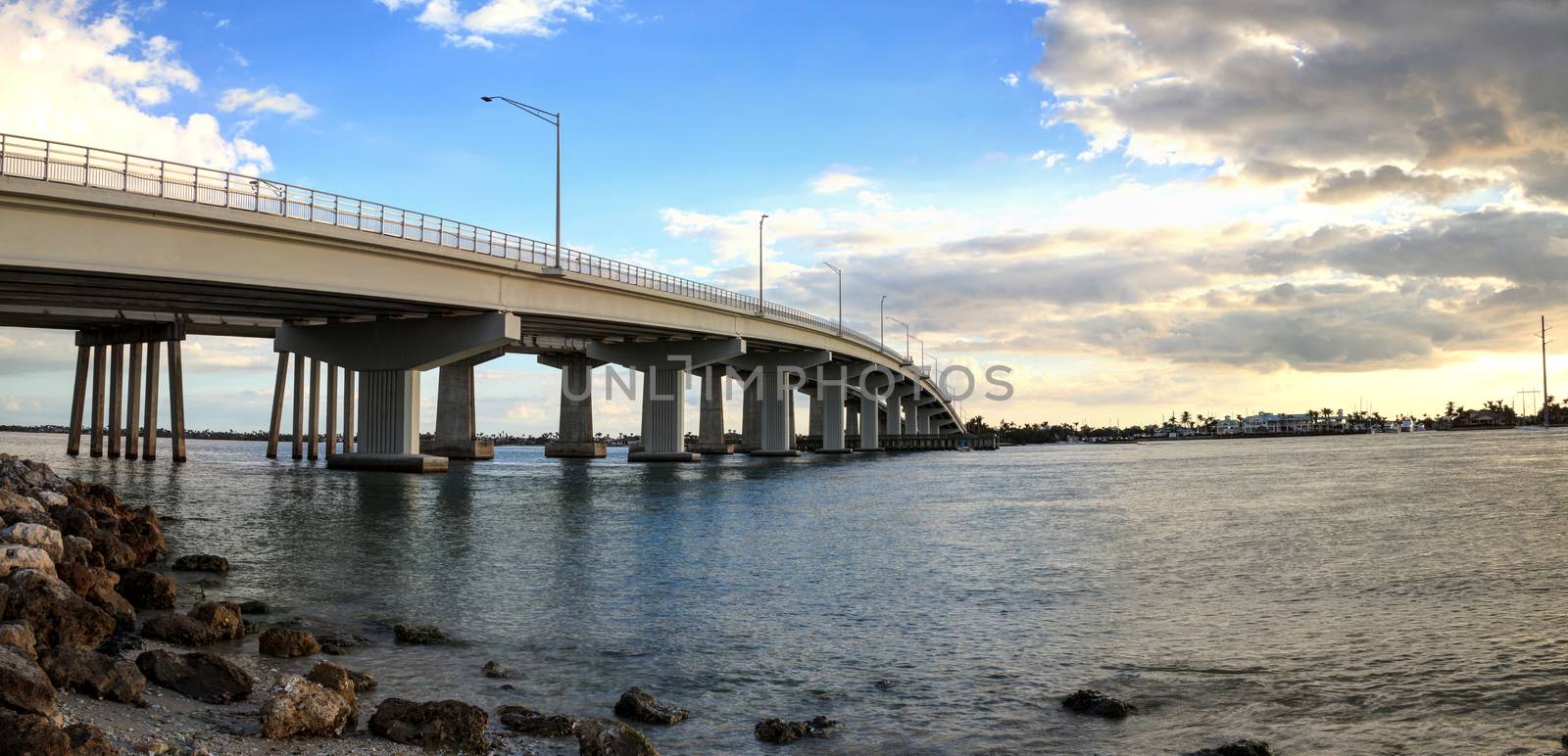 Blue sky over the bridge roadway that journeys onto Marco Island by steffstarr