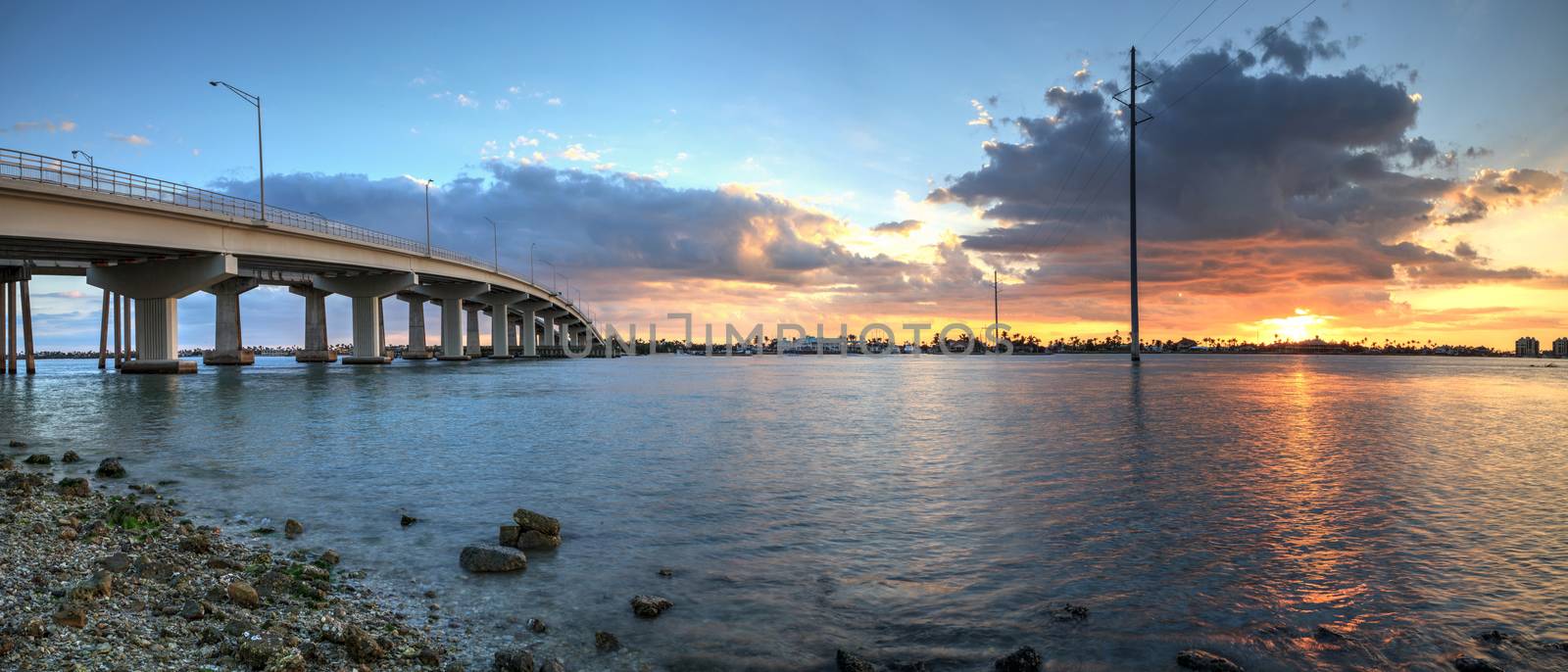 Sunset over the bridge roadway that journeys onto Marco Island, by steffstarr