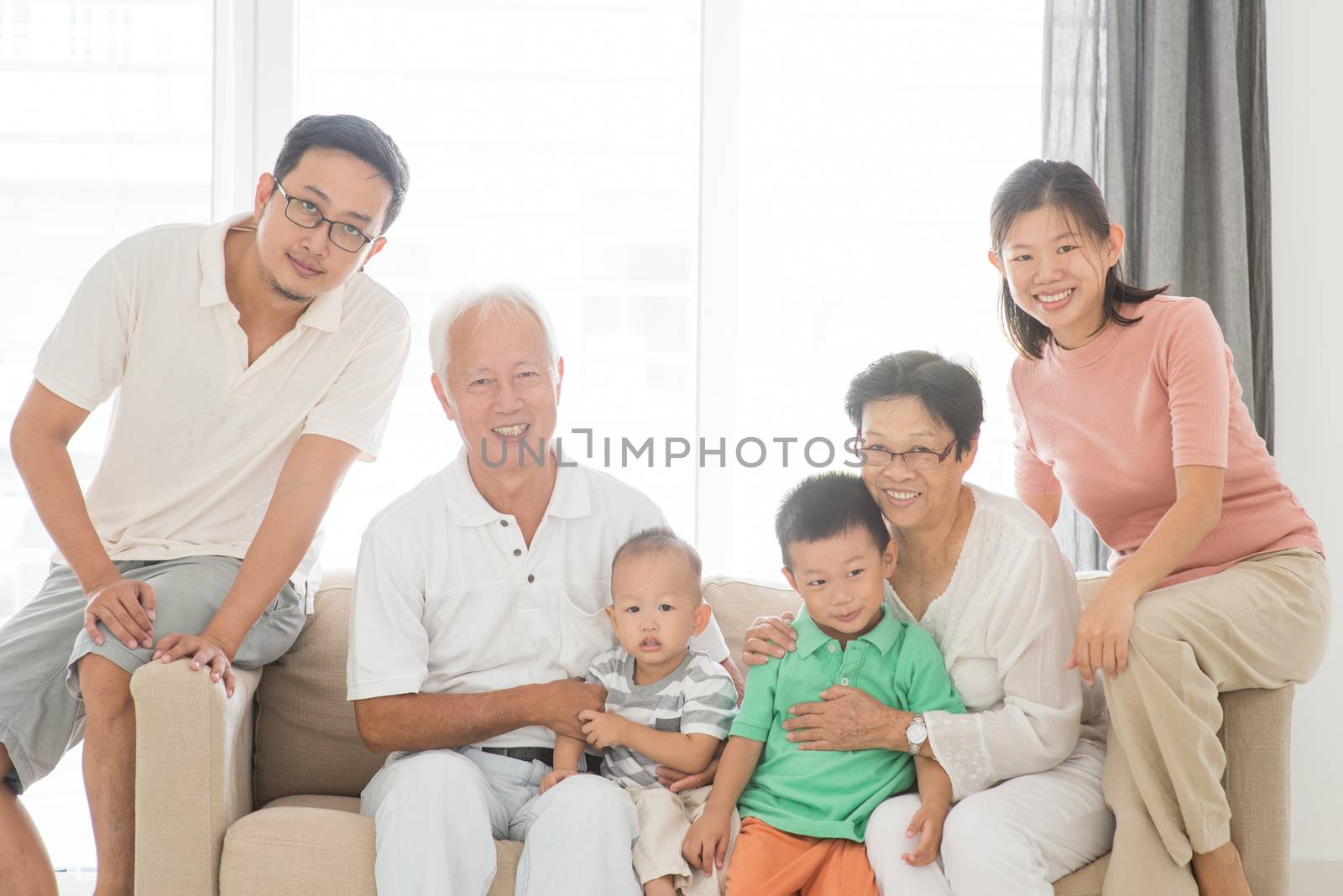 Happy Asian family at home, portrait of multi generations indoor lifestyle.