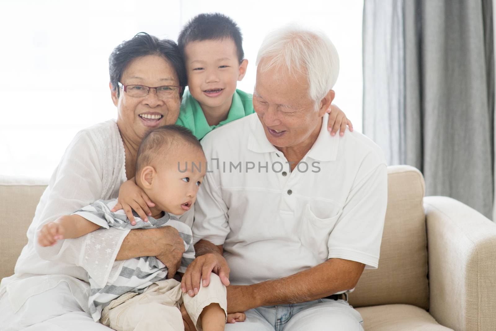 Asian elderly and children playing at home, old senior pensioner people indoor lifestyle.