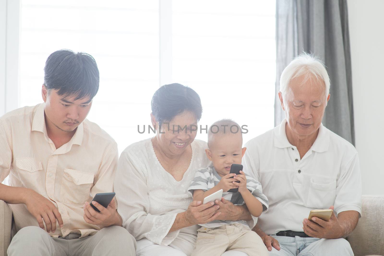 Technology, gadgets addicted family. Member family busy with their smart phone, communication problem.