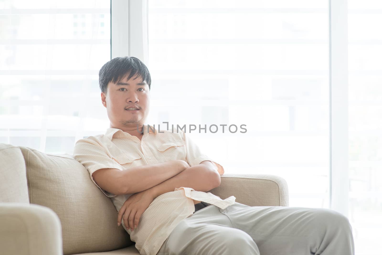 Portrait of Asian mature man at home, people indoor lifestyle.