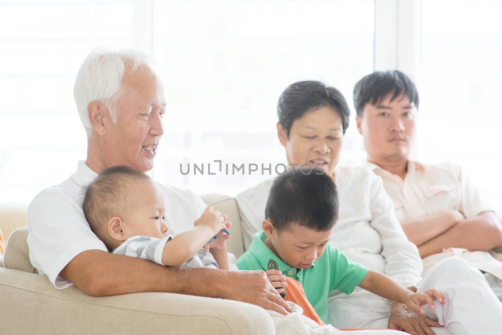 Candid of Asian family at home, multi generations people indoor lifestyle.