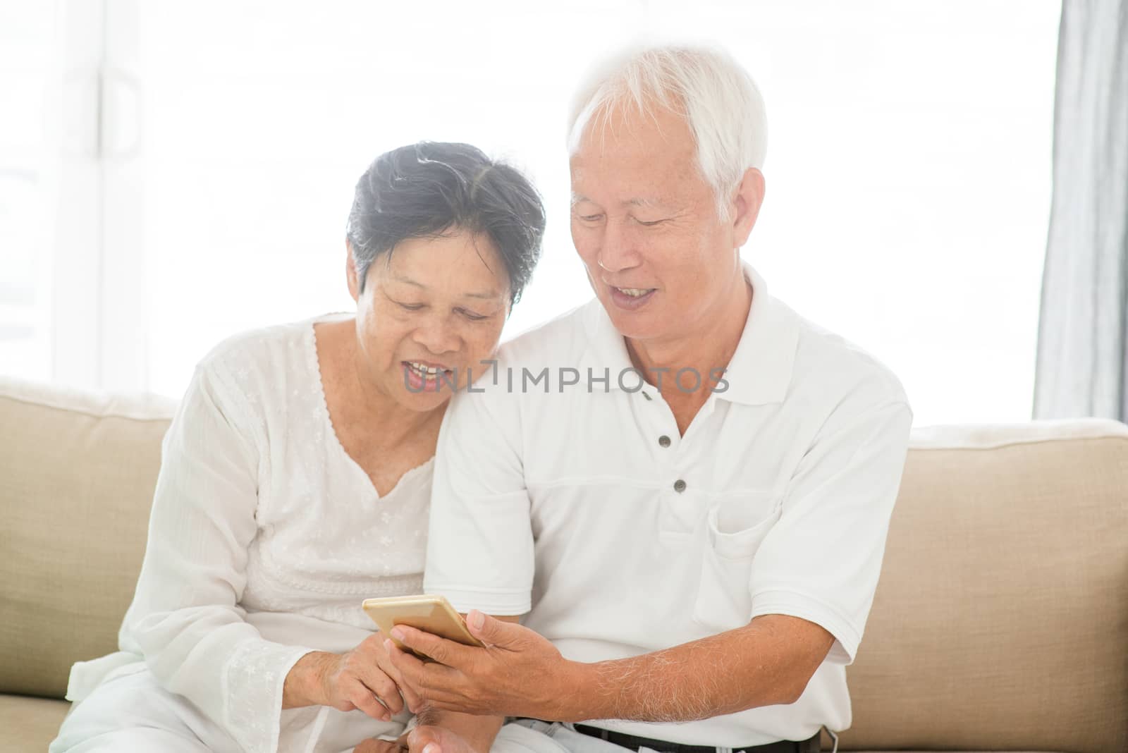 Old couple using smart phones  by szefei