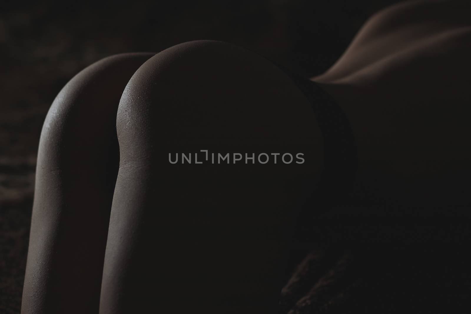 Back and butt naked women.on a black background by 3KStudio