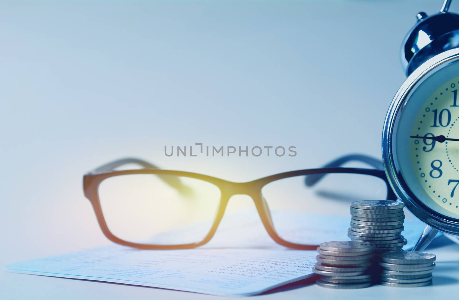Glasses with bank account passbook for savings financial and accounting concept.