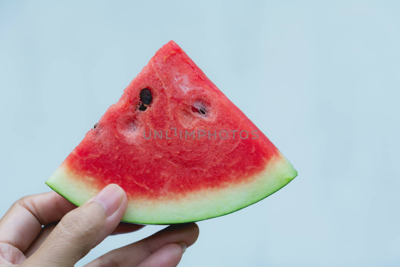 Woman holding watermelon. Portrait woman is holding slice of watermelon.