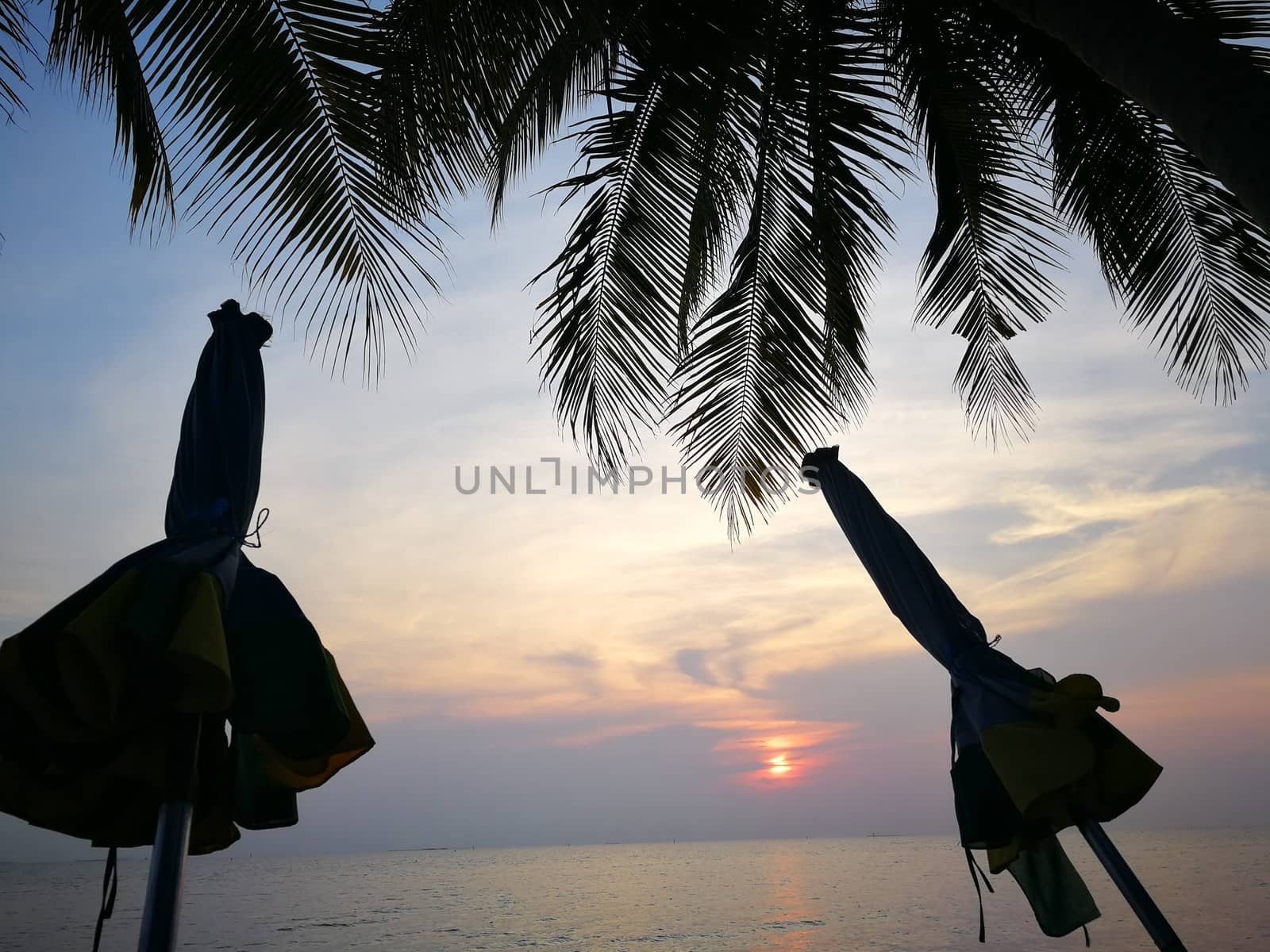 beautiful sunrise on the beach by shatchaya