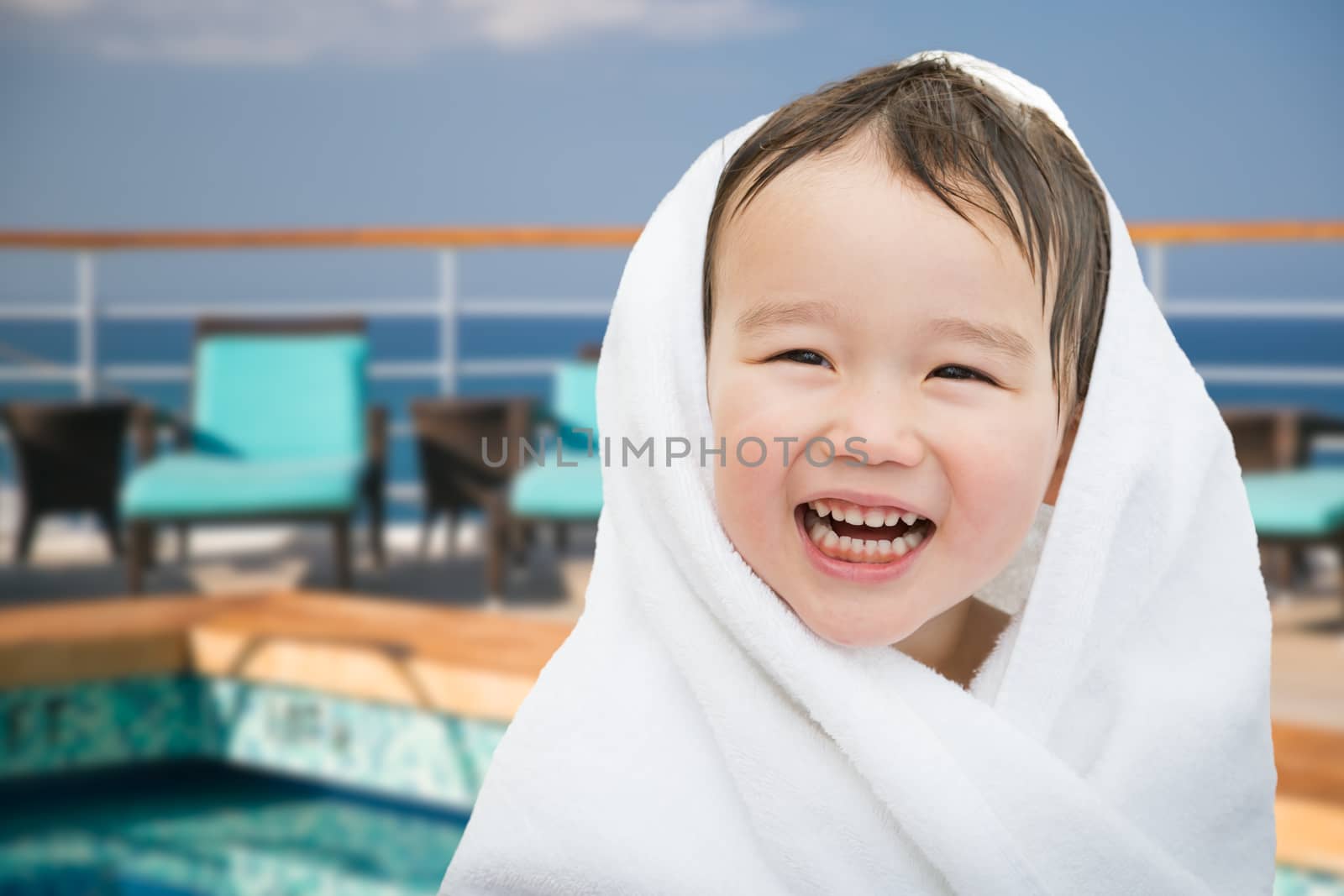 Happy Cute Mixed Race Chinese and Caucasian Boy On Cruise Ship W by Feverpitched