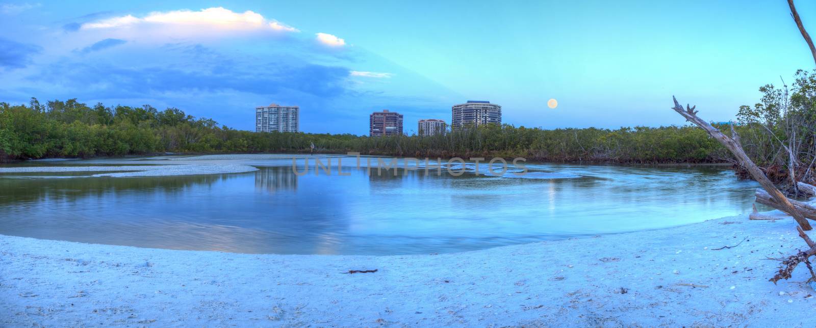 Moonrise over River leading to the ocean at Clam Pass by steffstarr
