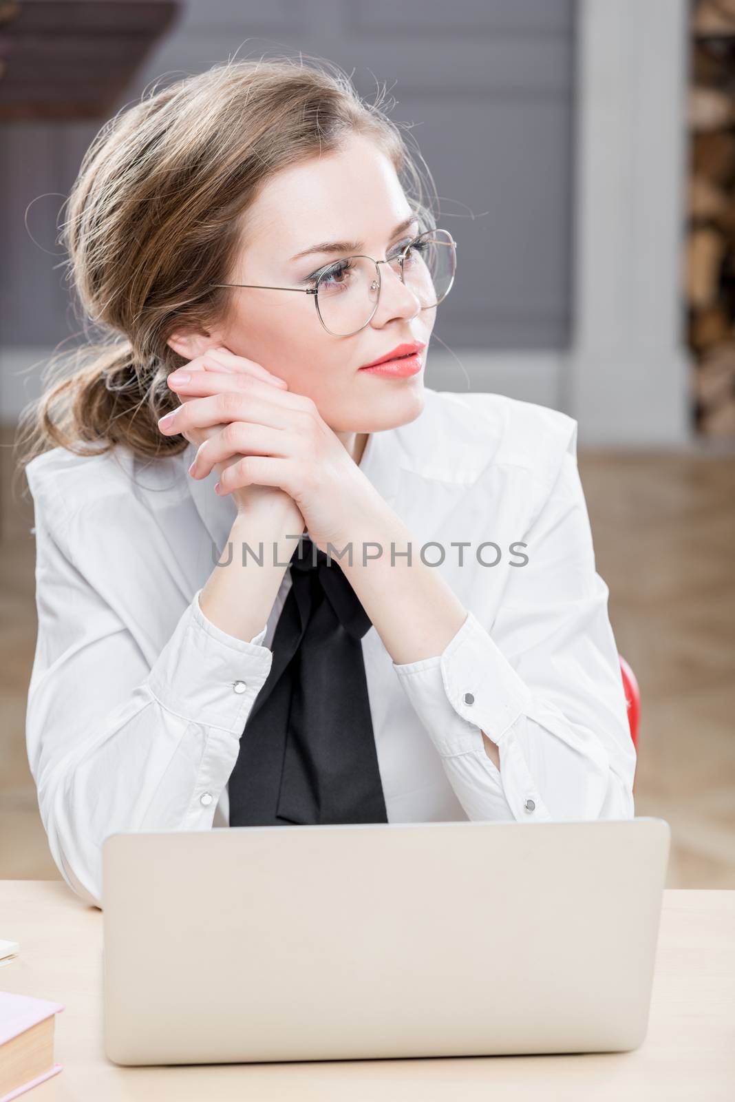 dreamy businesswoman with glasses at the computer by kosmsos111