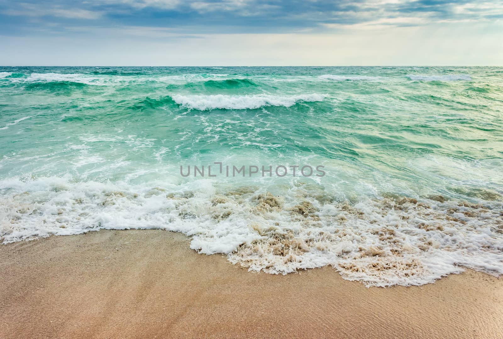 crushing waves on sandy beach by Pellinni