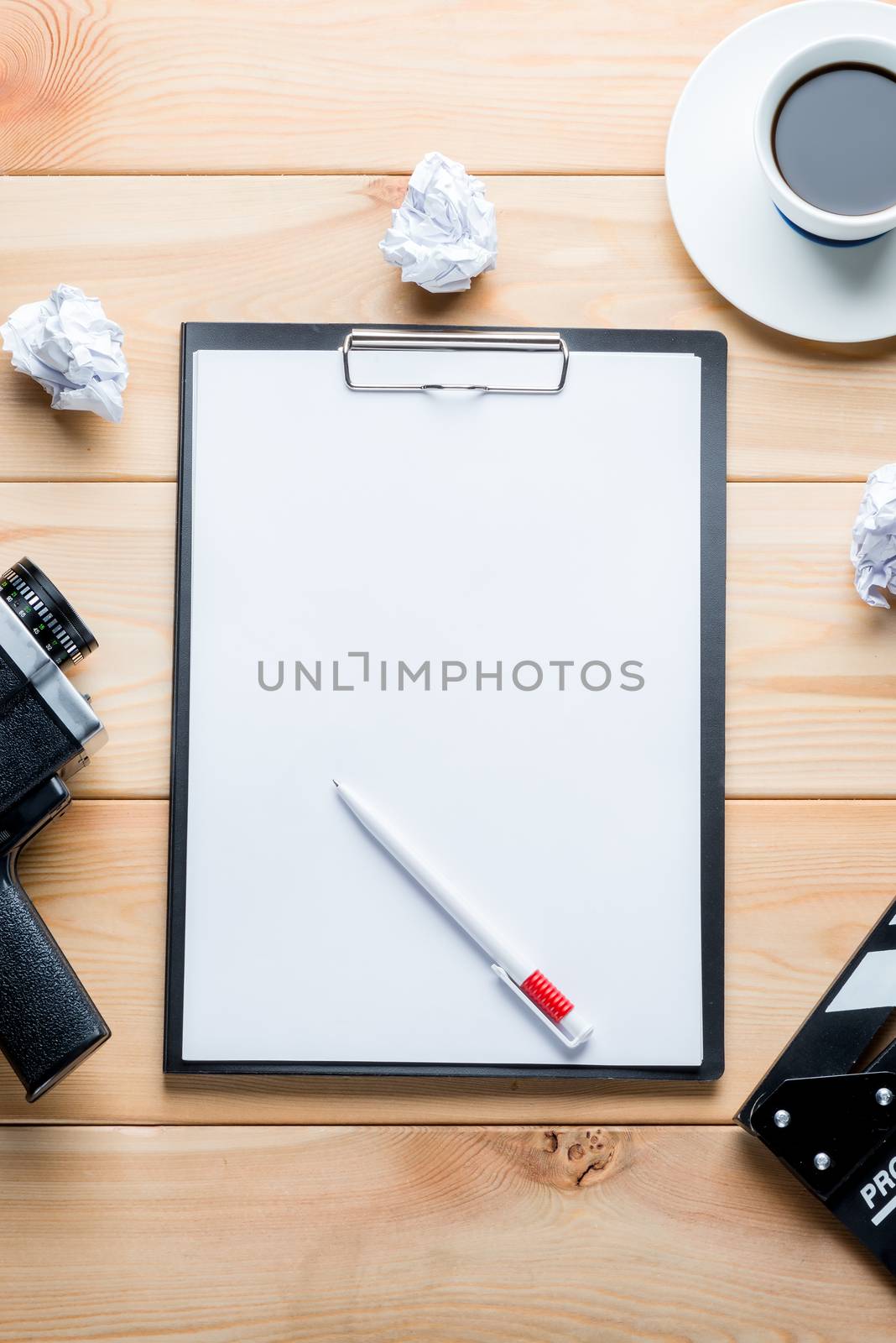 paper and objects for the film industry on a wooden background top view