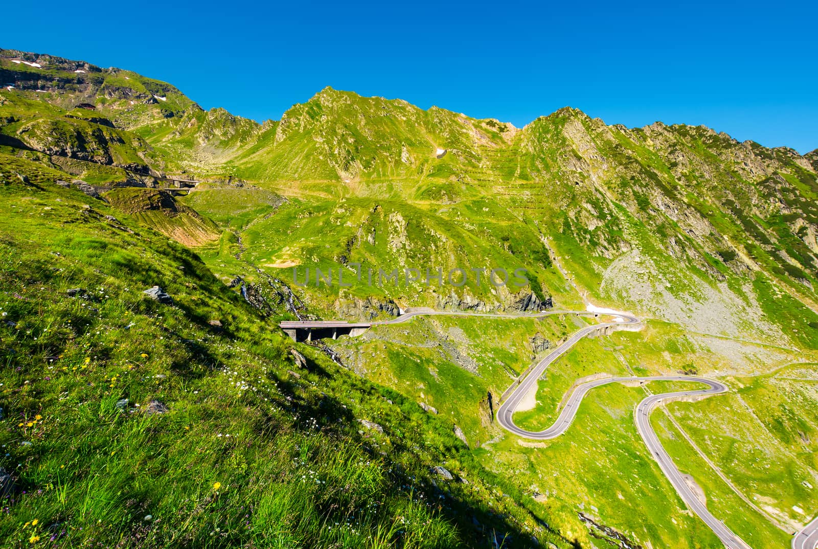 Transfagarasan road serpentine in the valley by Pellinni