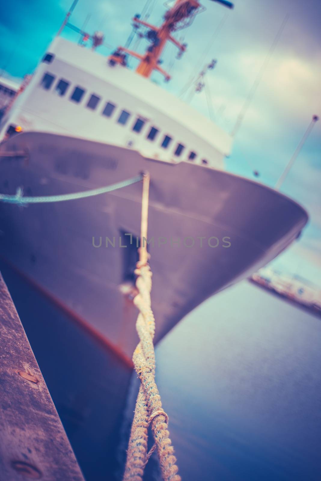 Retro Styled Industrial Ship Moored In Harbor With Shallow Depth Of Focus