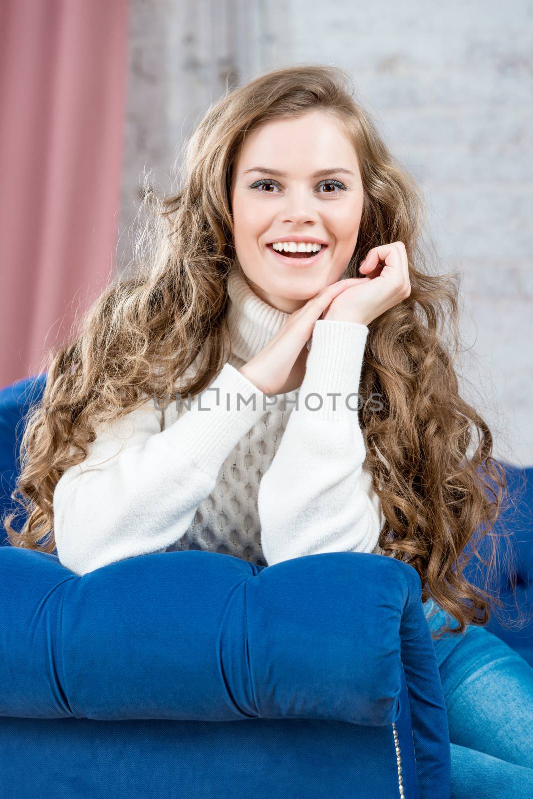 emotional beautiful girl in a warm sweater vertical portrait