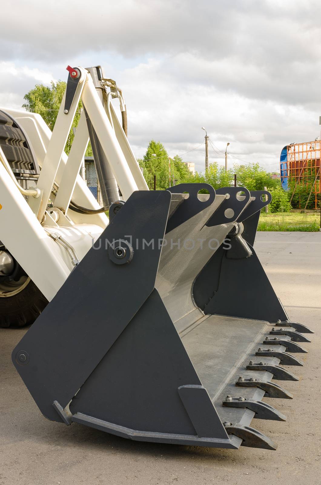 New road-construction equipment outdoors on the exhibition