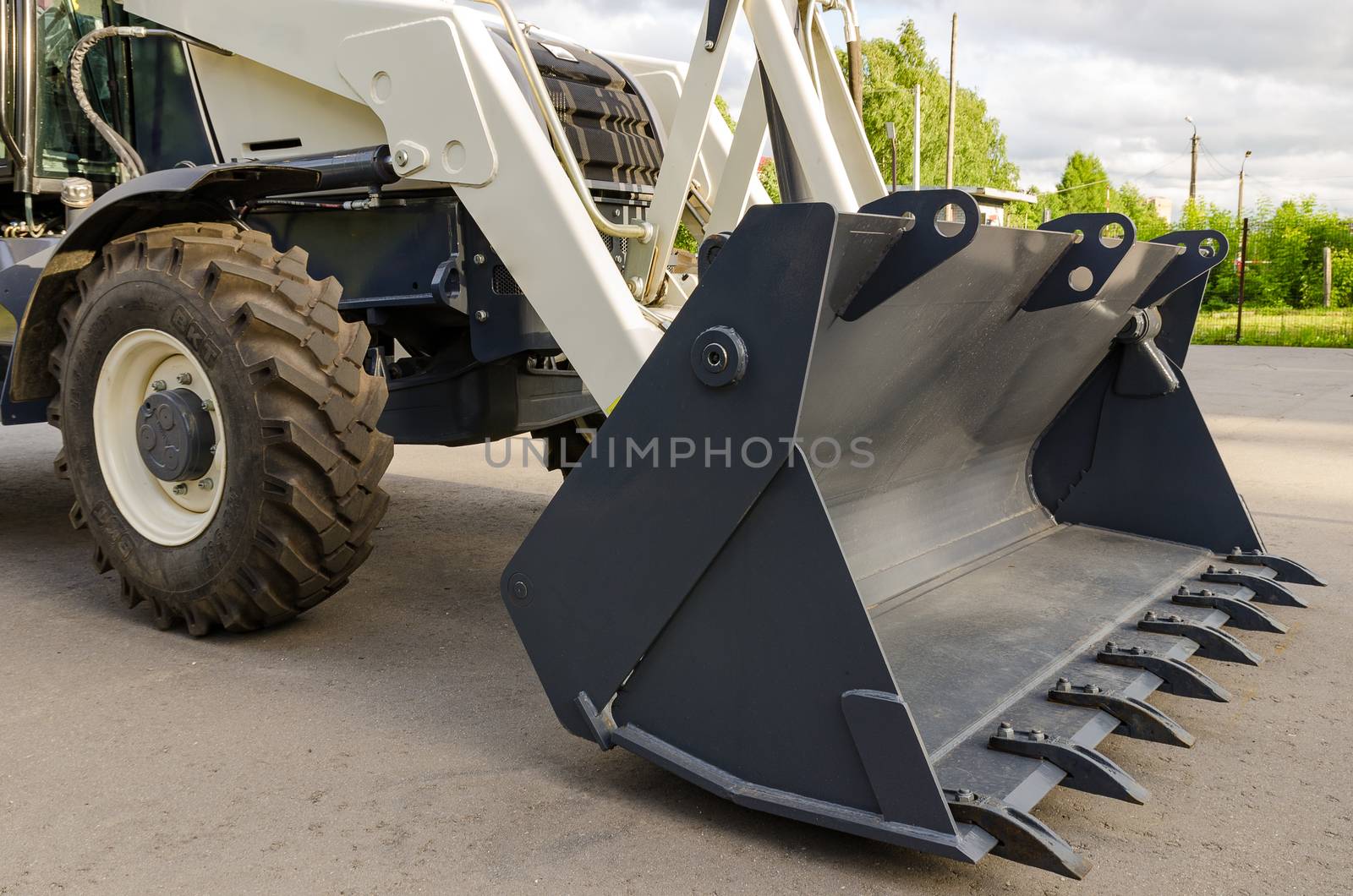 New road-construction equipment outdoors on the exhibition